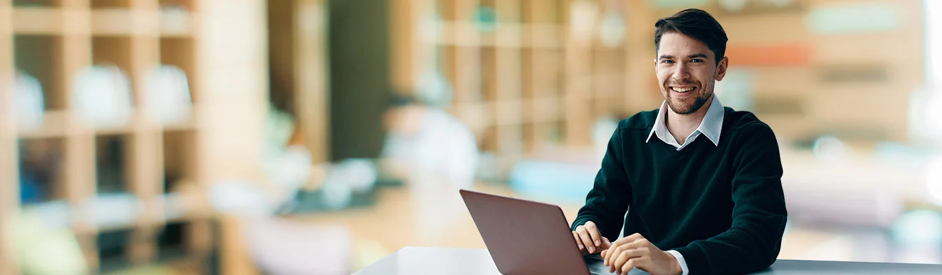 An Individual sitting with a laptop taking part in a BIM Training class