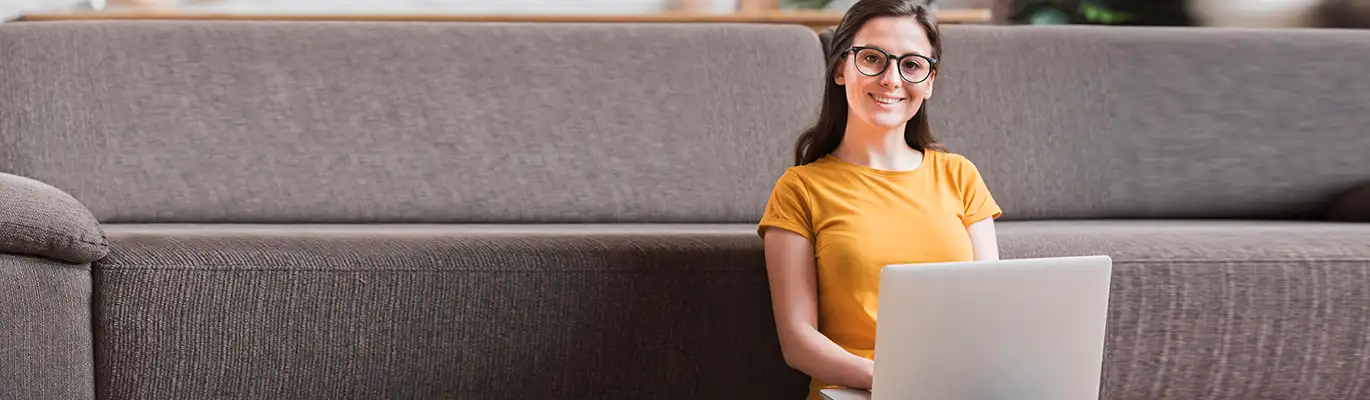 Picture of a cybersecurity student in front of a laptop
