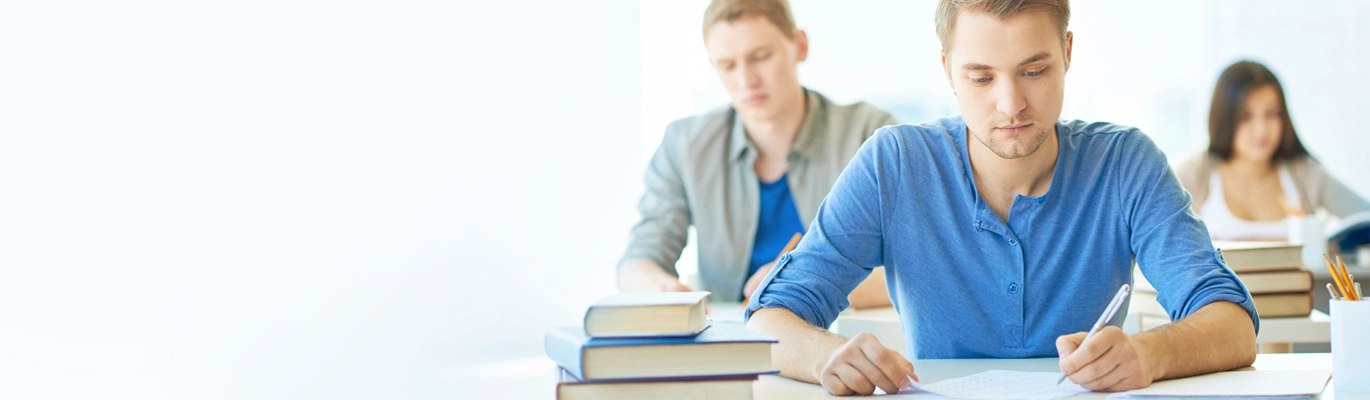 GMAT students sitting and writing 