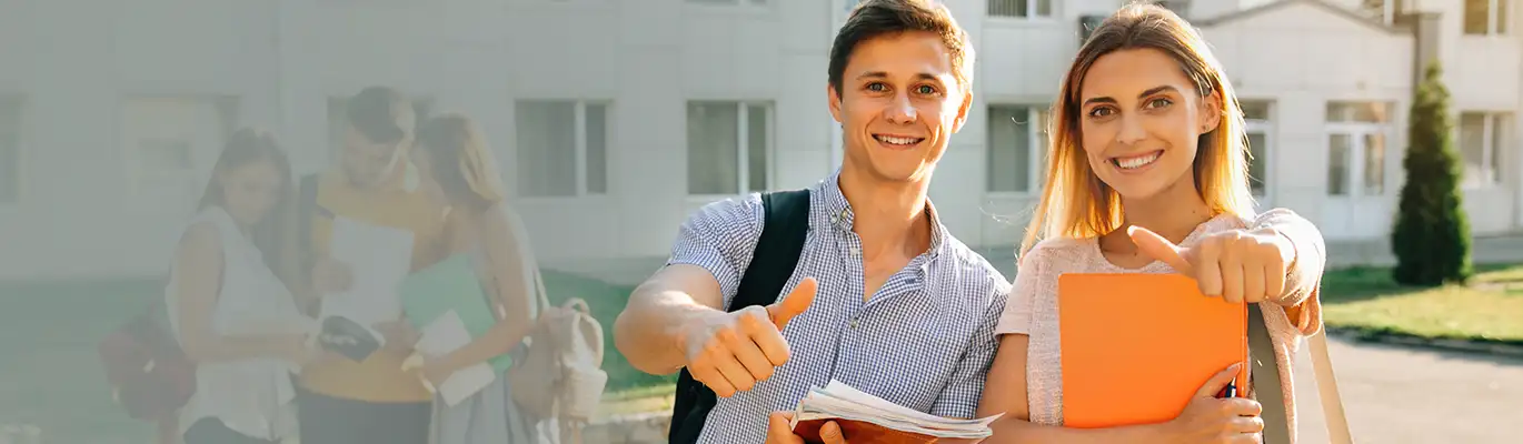 Two PSAT Students can be seen standing outside a campus 