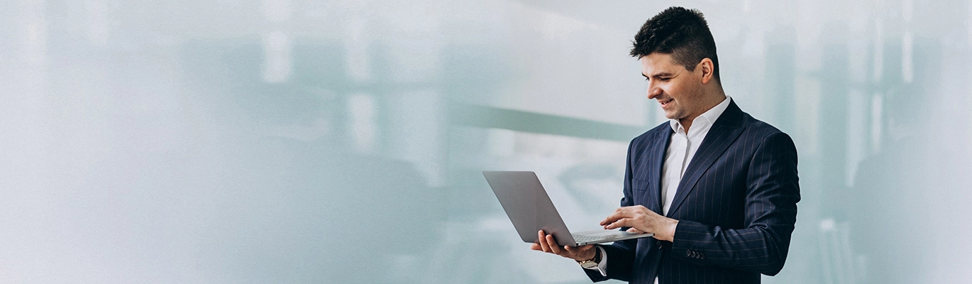 Tableau professional stand and holding laptop on hand