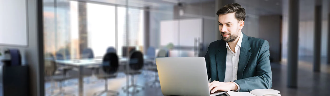 A professional sitting infront of a laptop and learning about Python Django Certification Course 