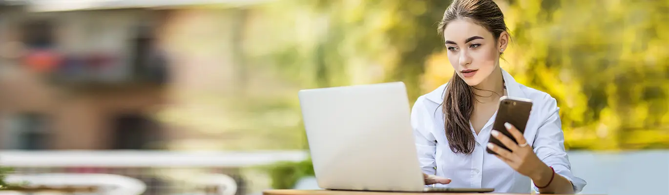 A professional sitting infront of a laptop and learning about Material Requirement Planning Course