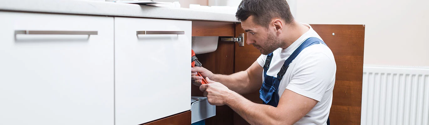 A plumber working on a plumbing design construction work