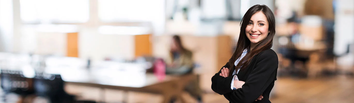 A professional stands in front of the CompTIA IT Fundamentals Training Classroom.