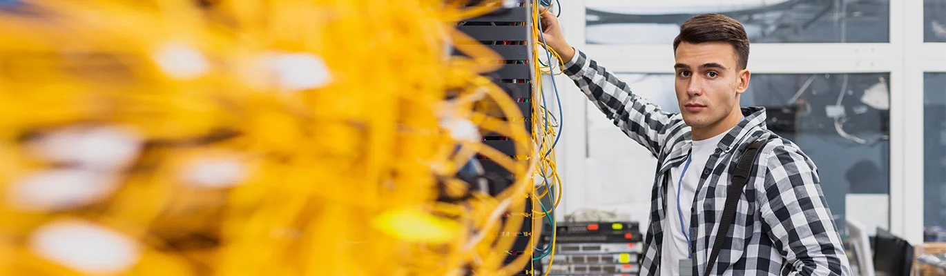 A student at an electrical design lab fixing some electrical wires 