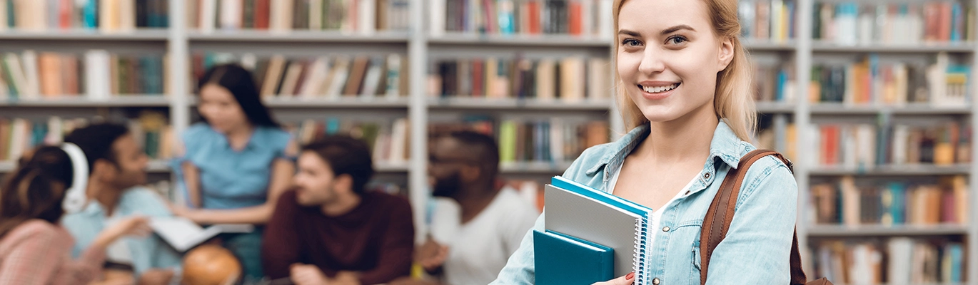 A language learning student smiling at the camera