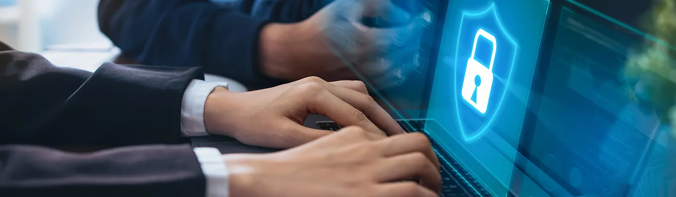 A student using a laptop to learn about network security