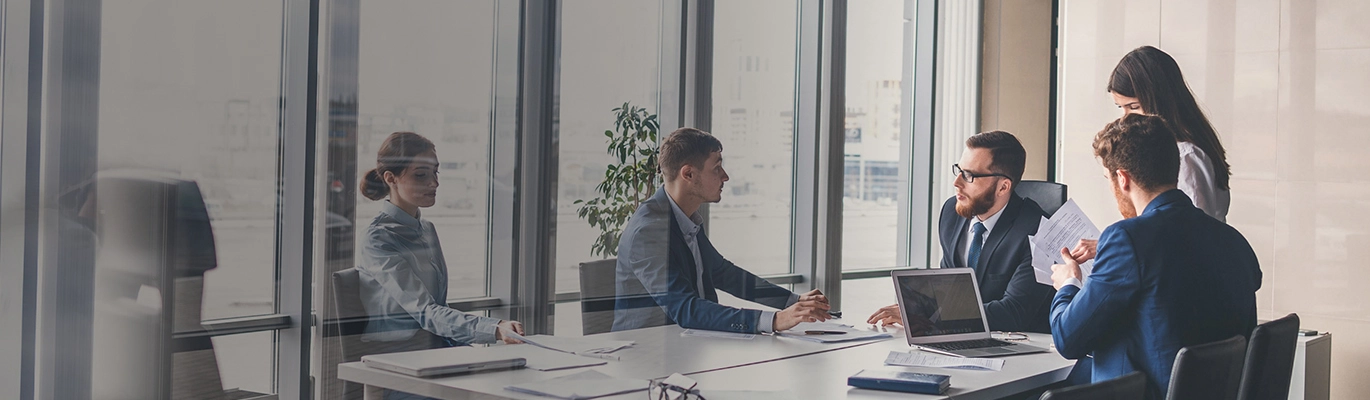 A group of sales professionals in a meeting