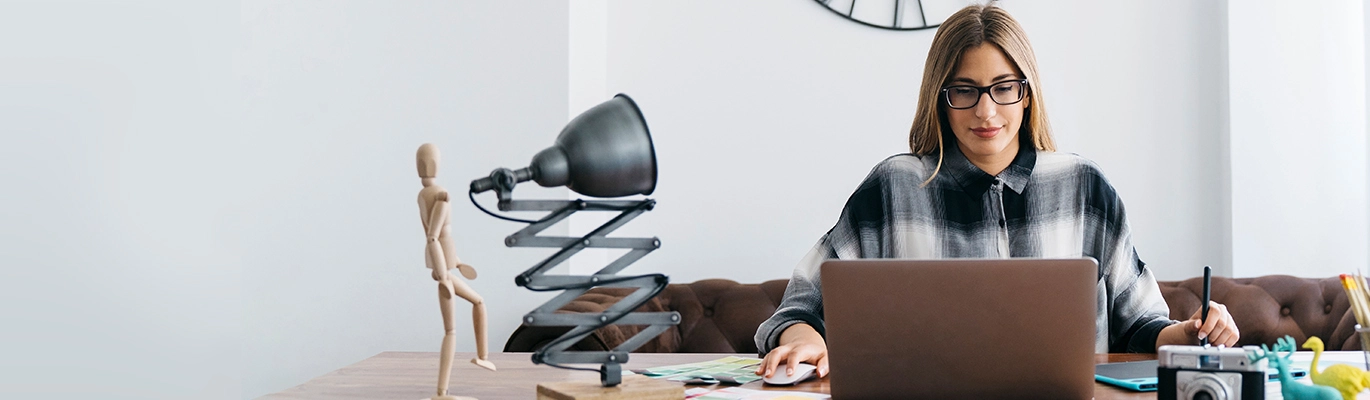 A woman working on a laptop